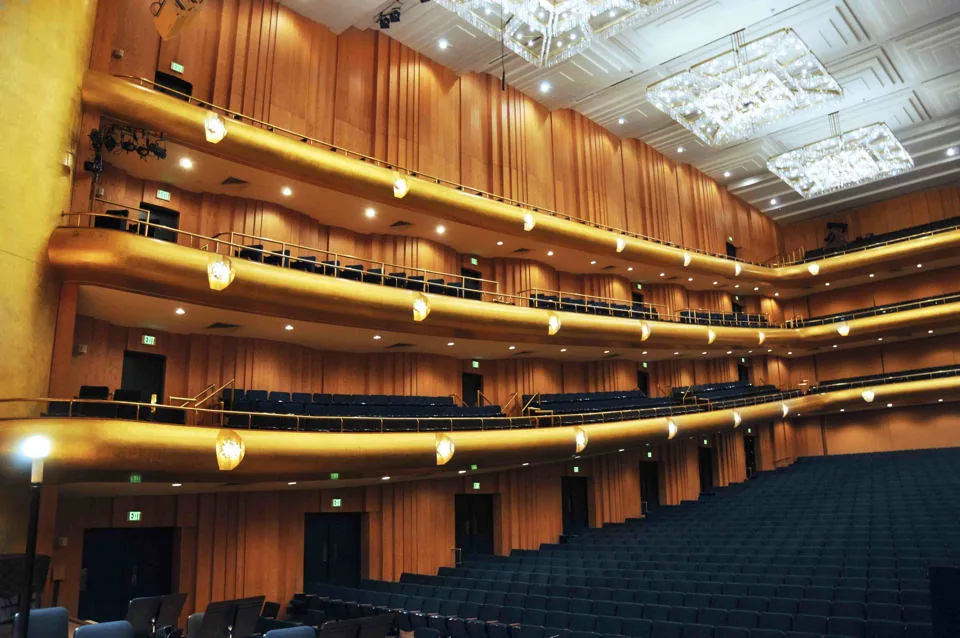Profiled balcony fronts wrapping the wood-lined auditorium of Abravanel Hall