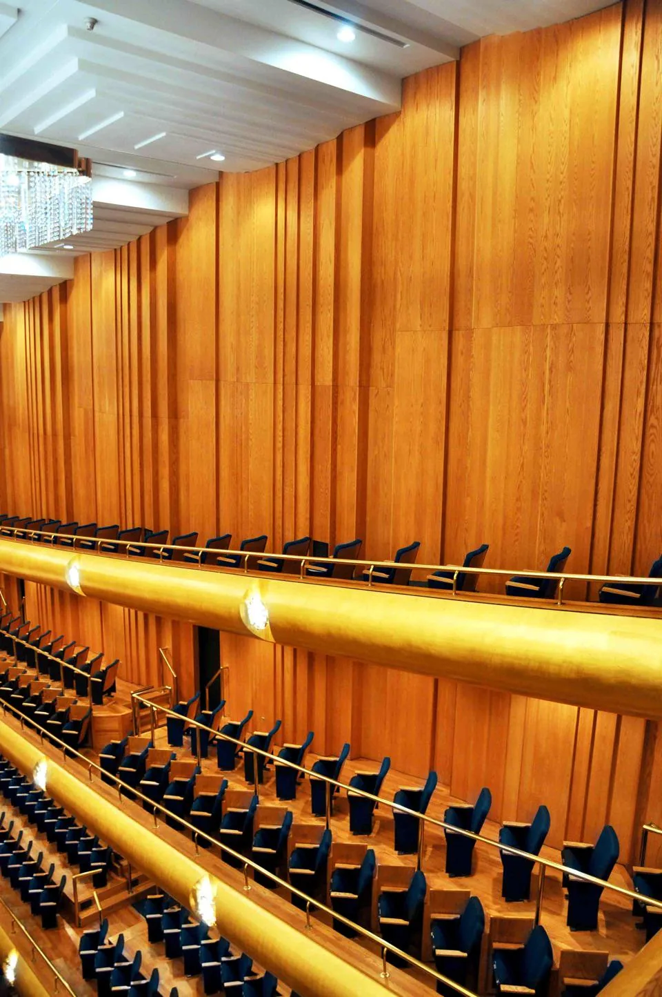 Curving balcony rails and wood-lined walls at Abravanel Hall