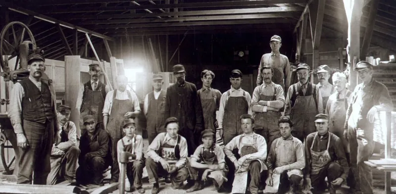 Archival photograph of a workshop crew, published by Granite Mill