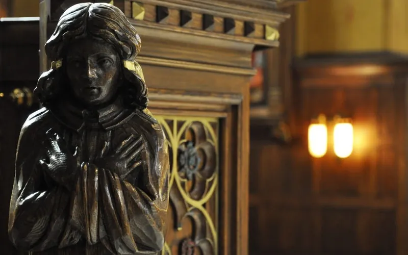 Carved wood figure and gothic detail work at the Cathedral of the Madeleine