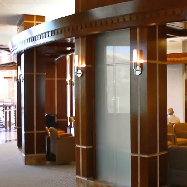 Curved wood reception millwork with inlaid trim at Huntsman Cancer Institute
